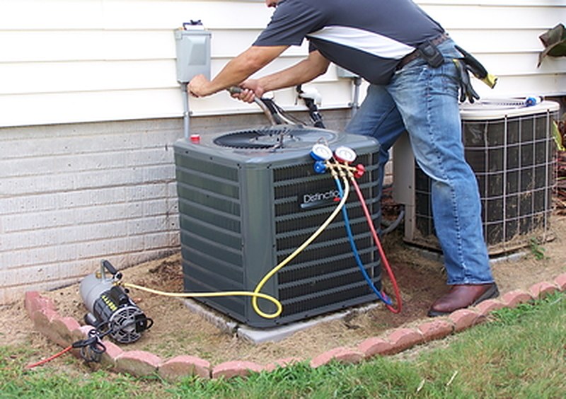 A C&N Mechanical technician arriving to work on an outdoor AC unit